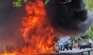 Huge fire destroys bus on road in Twickenham