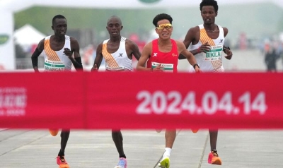 Beijing half marathon champion loses medal after competitors slowed down to let him win