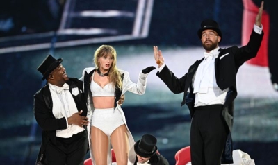 Travis Kelce says it was his idea to join Taylor Swift on stage - and reveals her reaction to his plan