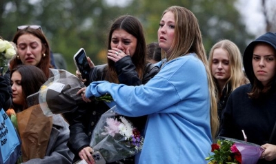 Tearful Liam Payne fans comfort one another at London vigil