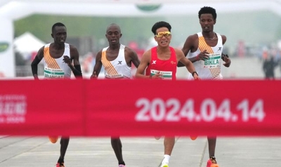 Beijing half marathon under investigation after three runners appear to allow Chinese man to win