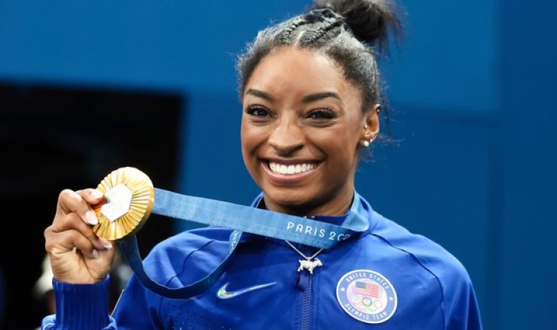 Simone Biles makes history yet again as she becomes oldest female gymnast to win all-around Olympic gold