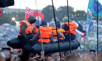 Banksy says Home Secretary James Cleverly&#039;s comments about his Glastonbury migrant boat stunt were &#039;a bit over the top&#039;