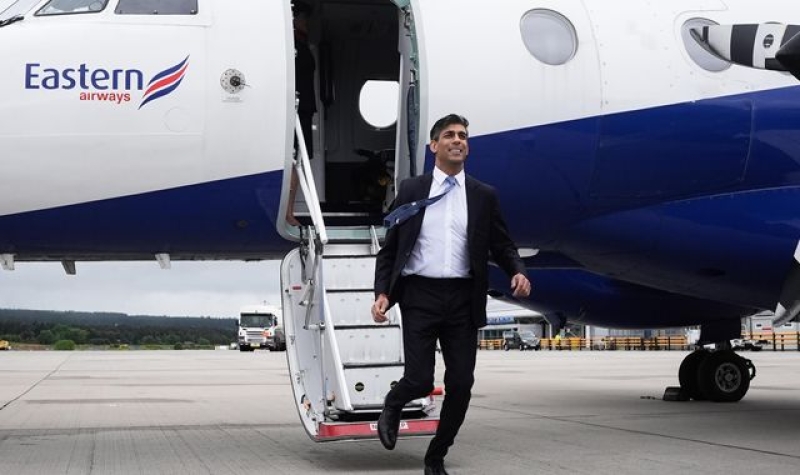 Rishi Sunak and Keir Starmer trade blows on migration as general election campaign begins