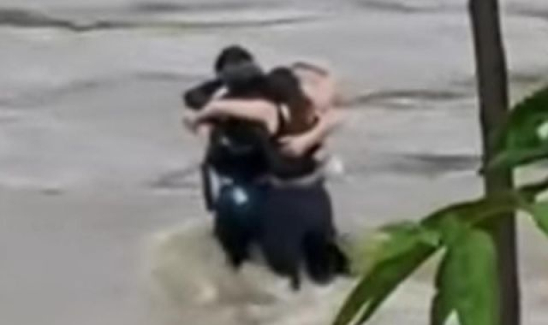 Three friends seen hugging before being swept away by floodwaters in Italy