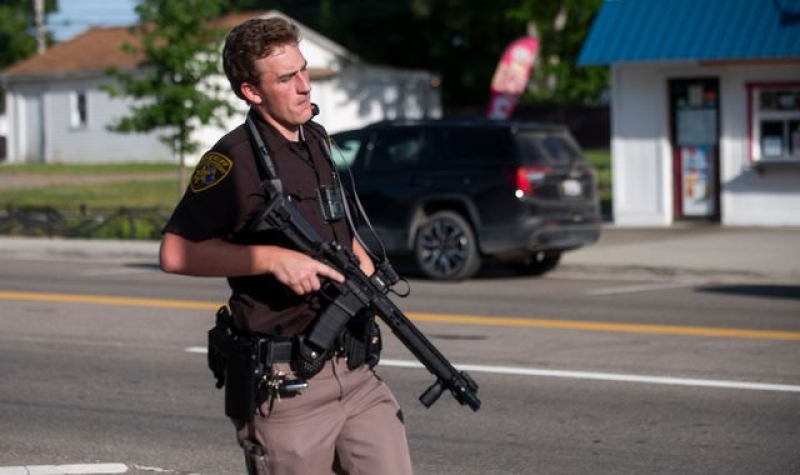 Boy, eight, and mother in critical condition as nine people injured in shooting at Detroit waterpark