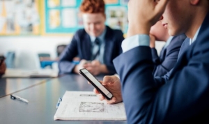 Schools which ban mobile phones get better GCSE grades, study finds